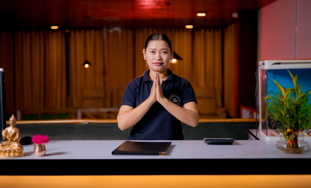 A Nepalese therapist greets everyone by doing Namaste.