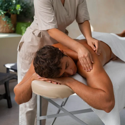 A man getting full body massage in a spa
