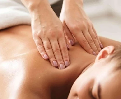 A woman getting swedish massage at a spa