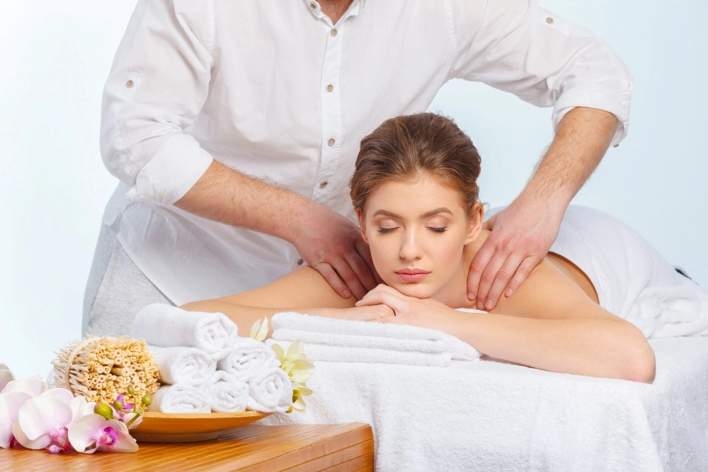 Beautiful, young and healthy woman in spa salon getting trekkers massage