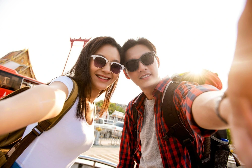 A couple enjoying their time and taking selfie after getting a couple spa package massage