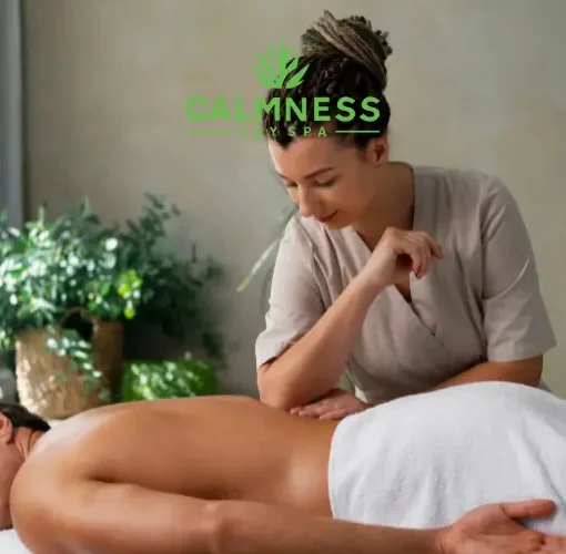 A man getting a massage in a spa by a massage therapist